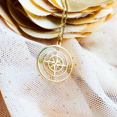 Our gold compass necklace is the perfect accessory for any adventurous spirit! With a beautiful compass pendant, it serves as a reminder to follow your own path and chase your dreams. Whether it's a graduation gift for women or a from-parents gift for a daughter, this necklace is a thoughtful and stylish choice. Make it even more special by adding a birthstone charm or initial disc. Order now and start your own journey with this stunning piece! ♡ DETAILS  Pendant  : 0.78"  x 0.78"(2 x 2 cm )  Ma Compass Design Pendant Charm Necklace As Gift, Compass Design Pendant Necklace As Gift, Gold Medallion Jewelry With Compass Design, Personalized Gold Necklace For Travel, Gold Compass Design Charm Necklace, Gold Compass Design Necklace For Travel, Gold Charm Necklace With Compass Design, Gold Compass Design Pendant Jewelry, Gold Medallion Jewelry For Travel