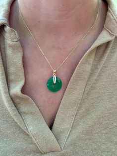 Our genuine Jade donut necklace is a must-have piece!  Information:  ✨ Sterling Silver (925 stamped) | 14K Gold Plated ✨ Genuine Jadeite gemstone ✨ Adjustable length: 16" - 18" ✨ Hypoallergenic ✨ Tarnish resistant This necklace is crafted with high quality materials and craftsmanship. In our necklace, we used a Grade B Jadeite stone, polished for shine and brilliance.  The Jade stone is dainty, roughly the size of a quarter making it perfect for those that love small charms. On the metal that holds the Jade donut, we used AAA Cubic Zirconia gemstones to add a modern touch to the necklace, giving it a feminine aura. The necklace is adjustable from 16", 17" and 18" allowing you to find the perfect fit. This makes a great gift. Luxury Jade Jewelry With Round Stone, Real Jade Jewelry, Feminine Aura, Donut Jewelry, Donut Necklace, Necklace Green, Jade Necklace, Small Charms, Jade Jewelry