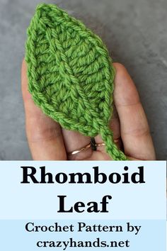 a hand holding a green crochet leaf with the words rhomboid leaf on it