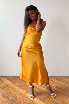 Looking for the perfect classy dress that will have you shining bright at your next event? This gold slip dress outfit offers a touch of glamour for any occasion. Whether you're pairing this look with sneakers for a causal classy look or wearing as a wedding guest look, this champagne slip dress is a stunning choice to show your feminine and classy side. Click the link to shop this product and make a statement at your next special event. Gold V-neck Midi Dress For Party, Gold V-neck Evening Dress For Summer, Gold Evening Dress For Summer, Elegant Gold Midi Dress With Spaghetti Straps, Gold Spaghetti Strap Midi Dress, Gold Spaghetti Strap Evening Dress For Wedding, Chic Gold Midi Dress For Party, Gold Midi Dress For Gala, Chic Gold Evening Dress For Night Out