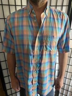 Pastel Plaid Colored Shirt - Size m but fits like a L -  $30 Be the talk of the party or just the cool guy at the beach or bbq. This shirt is sure to turn heads and show that you know what good style is.  #cooldadshirt #bbqshirt #stylishman #vacationvibes #beachvibes #chillvibes #tikivibes Casual Short Sleeve Tops For Warm Weather, Casual Multicolor Short Sleeve Shirt For Beach, Casual Multicolor Short Sleeve Beach Shirt, Casual Multicolor Short Sleeve Shirt For Summer, Casual Fitted Short Sleeve Shirt For Vacation, Fitted Casual Short Sleeve Shirt For Vacation, Summer Plaid Button-up Short Sleeve Shirt, Casual Plaid Summer Tops, Casual Summer Plaid Tops