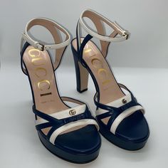 New Without Box Gucci Alison Heels Heel Height: 105mm Navy And White Two Tone Gold Hardware Belt Closure At Ankle Stacked Platform Heels Size 37.5 Made In Italy Blue Open Toe Gucci Sandals, White Gucci Sandals For Party, Gucci White Ankle Strap Heels, Gucci Block Heel Heels With Heel Strap, Gucci Heels With Heel Strap And Block Heel, Gucci Block Heels With Heel Strap, Gucci Heels With Ankle And Heel Strap, Gucci Heels With Ankle Strap And Heel Strap, Gucci Heels With Heel Strap And Ankle Strap