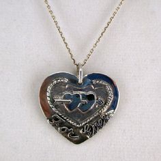 "This antiqued sterling silver, two-sided, solid Forever and Ever Heart pendant features a double-pierced heart design with \"Forever\" inscribed on the front and \"And Ever\" inscribed on the back. Marked, Sterling. Made by Brown County Silver. Vintage and in new, never worn condition. Approximately 30 years old. 1 1/8\" high with jump ring 1 1/8\" wide 6.9 grams See more @ https://www.etsy.com/shop/brocosi" Nickel Free Double Heart Jewelry For Anniversary, Nickel Free Heart Pendant Jewelry For Anniversary, Vintage Nickel-free Heart Necklace For Anniversary, Nickel-free Heart-shaped Jewelry For Anniversary, Vintage Double Heart Sterling Silver Necklace, Silver Stamped Heart Pendant Jewelry, Vintage Sterling Silver Double Heart Necklace, Anniversary Double Heart Necklace With Hallmark, Nickel Free Jewelry For Anniversary On Valentine's Day