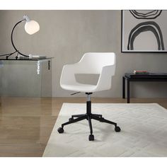 a white office chair sitting on top of a wooden floor next to a glass table