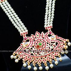 Original Design by Classical Dance Jewelry® ❥ Pearl Kempu Long Haram Chain is traditional and ethnic South Asian Indian Jewelry. ❥ 4 lines Open Peacock Style Pendant Pearls Long Necklace. ❥ You Can wear this set for Bharatnatyam Kuchipudi Dance Performances, Engagement, Weddings, Birthdays, festivals, puja, Ammavaru Amman decorations, Durgamata Decoration ❥ Handmade Indian Traditional Item. ❥❥❥ Set has variations please CHECKOUT Variants ☛ Long Necklace with earrings ☛ Long Necklace without earr Traditional Kundan Necklace With Motifs For Celebration, Kundan Meenakari Necklace For Traditional Ceremonies, Kundan Necklace With Meenakari For Traditional Ceremonies, Kundan Necklace With Meenakari For Traditional Festivals, Bollywood Bridal Necklace For Navratri Ceremonial, Traditional Bridal Necklace For Puja And Diwali, Tilla Bridal Necklace For Puja And Navratri, Navratri Tilla Bridal Necklace For Puja, Bollywood Bridal Necklace For Navratri