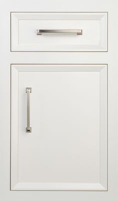 a close up of a white cabinet door