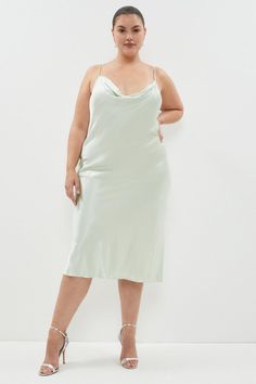 Live out your Nineties style dream in this silky satin slip dress. Detailed with a draped cowl neckline and slender spaghetti straps, this slinky, curve-skimming design is sure to turn heads at every summer soiree.Expertly designed for those size 18 and above, our plus size collection is perfectly proportioned to ensure you look stylish at every shape.Style: Slip DressDesign: PlainFabric: SatinLength: MidiNeckline: CowlSleeve Length: Sleeveless Cowl Neck Midi Dress, Plus Size Satin, Summer Soiree, Cowl Neckline, Satin Slip, Satin Slip Dress, Look Stylish, Cowl Neck, Plus Size Dresses