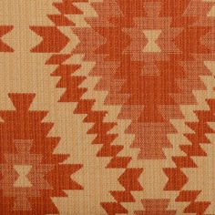 an orange and white pattern on fabric