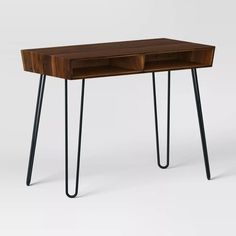 a wooden desk with hairpin legs and a drawer on the top that is open