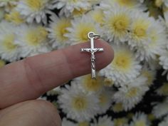 "Tiny Crucifix Charm Small crucifix cross with an antique silver finish. The small size makes them perfect for dainty necklaces, charm bracelets, or small rosary chaplets. Size: 22mm long x 11.11mm wide (7/8\" long x 7/16\"wide) Made from a zinc-based alloy which is lead, nickel, cadmium safe." Silver Cross Rosary Bracelet, Nickel-free Silver Cross Rosary Bracelet, Silver Cross Rosary As Gift, Nickel-free Silver Cross Rosary, Small Rosary, Rosary Cross, Crucifix Necklace, Dainty Necklaces, Bracelet Charms