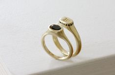 "Queen Crown ring - A minimalist flat top oval signet ring made of 14K yellow gold with  black round cut onyx / spinel set in a delicate frame - a new interpretation for a woman signet modern ring. This timeless piece is designed to create a delicate statement ring that could be the perfect ring for any special event such as graduation / retirement / birthday gift. This ring is made of solid yellow gold but could be ordered in 14K white or rose gold  Specifications: Top oval size: 6.5X9 mm / 0.26\" X 0.35\" Inch Stone Size: 5X7 mm / 0.2\" X 0.28\" Inch Bottom ring thickness: 2 mm / 0.08\" Inch Top height: 5 mm / 0.31\" Inch * You wish to have engraving on this ring?  please enter:     https://etsy.me/2Hl40bo * Feel free to contact me with any questions or requests. FOR MATCHING ITEMS http: Elegant Oval Sapphire Ring With Smooth Bezel, Modern 14k Gold Oval Signet Ring, Classic Sapphire Ring With Smooth Bezel, Elegant 14k Gold Signet Ring With Smooth Bezel, Modern Oval 14k Stamped Signet Ring, Modern 14k Stamped Oval Signet Ring, Elegant Black Signet Ring For Everyday, Elegant Black Everyday Signet Ring, Oval Signet Ring With Smooth Bezel For Wedding