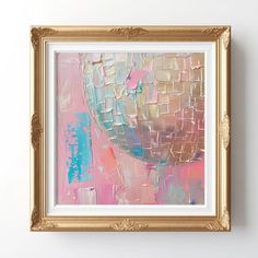 an abstract painting in gold frame on the wall