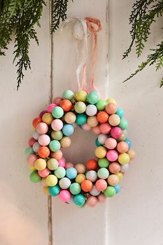 an easter wreath hanging on a door