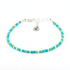 Dainty bracelet - green Blue Jewelry With Silver Beads For Summer, Turquoise Friendship Bracelets With Tiny Beads For Summer, Blue Beaded Bracelets With Silver Beads For Beach, Turquoise Friendship Bracelet With Tiny Beads, Summer Friendship Bracelets With Tiny Turquoise Beads, Turquoise Summer Friendship Bracelet With Tiny Beads, Adjustable Blue-green Beaded Jewelry, Green Beaded Bracelets With Silver Beads For Gifts, Turquoise Friendship Bracelets With Colorful Beads For Summer