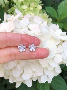 925 Sterling Silver Cz Flower Stud Earrings - Metal: 925 Sterling Silver (Finish: Rhodium Plated) - Stone: Clear Cubic Zirconia, Pear Cut, Prong - Shape: Flower - Dimension: 9mm(0.35 in), Thickness 1.5mm (Please note that the flower is SMALL.) - Closure: Post at Center, Push Back - Color: Silver Sparkling Cubic Zirconia Flower Earrings, Flower Shaped Cubic Zirconia Earrings In Diamond White, Sterling Silver Flower Earrings For Mother's Day, Diamond White Cubic Zirconia Flower Earrings, Sterling Silver Flower Earrings For Anniversary And Mother's Day, Flower Shaped Sparkling Stones Jewelry For Gifts, Flower-shaped Jewelry With Sparkling Stones For Gift, Cubic Zirconia Round Flower Earrings For Gift, Silver Flower Earrings With Sparkling Cubic Zirconia