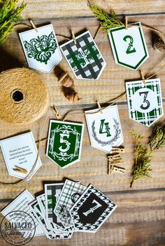 green and white monogrammed tags on twine with pine branches, sprigs and twine