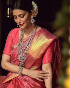 Description This layered bridal silver necklace by Paksha showcases absolute attention to detail, this layered long necklace features numerous AAA quality CZ stones in elegant white and green contrats, it’s crafted with floral and peacock motifs in a two-tone gold plated setting, wear it solo or style with choker for a grand look. This necklace is part of shruti haasan edit, designed by Creative Director at Paksha. Product Information Materials used : 925 Silver with 1.0-microns Gold Plating Sto Silver Temple Necklace With Peacock Design For Wedding, Silver Kundan Necklace With Peacock Design For Wedding, Silver Peacock Design Bridal Necklace, Silver Bridal Necklace With Peacock Design For Wedding, Silver Bridal Necklace With Peacock Design, Dual-tone Fusion Style Temple Necklace For Wedding, Dual-tone Bridal Necklace For Wedding, Dual-tone Fusion Temple Necklace For Wedding, Festive Dual-tone Bridal Necklace For Wedding