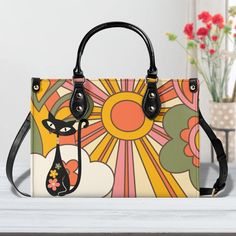 Be the cat's meow with our Atomic Cat Handbag! This Groovy Retro Mod Shoulder Bag combines Mid Century Modern Kitsch with a sunburst design for a GAL Purse unlike any other. With its quirky style and spacious design, you'll be turning heads everywhere you go. (Paws-ibly the coolest bag you'll ever own!) My handbag designs are truly unique and born from original creative vision. Anyone attempting to mimic my style is simply lacks as an unethical seller. Recently featured in both the summer and fa Daily Use Crossbody Bag With Cat Design, Trendy Shoulder Bag With Cat Design, Cat Design Shoulder Satchel, Casual Multicolor Shoulder Bag With Cat Design, Casual Multicolor Cat Design Shoulder Bag, Trendy Cat Design Shoulder Bag For Shopping, Everyday Rectangular Bag With Cat Print, Trendy Cat Print Shoulder Bag For Everyday Use, Trendy Travel Bags With Cat Print