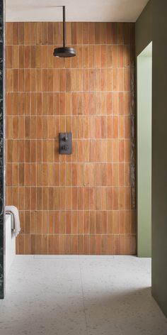 a bathroom with tiled walls and floor