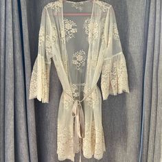 Perfect For A Bridal Look! This Stunning Lace Kimono Has Beautiful Details All Throughout, Especially On The Stunning Bell Sleeves. Do Not Miss This One! Lace Kimono, Bridal Look, Sleepwear Robe, Bridal Looks, Women's Intimates, Bell Sleeves, Furniture Decor, Cream, Lace