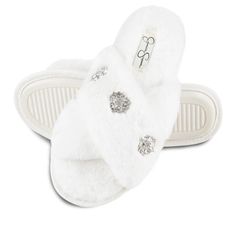 Step into a cloud of comfort with the Jessica Simpson Women's Jewel Embellished Cross Band Slip-On Slippers. These slippers redefine cozy with their ultra-soft, plush texture that feels softer than the fluffiest cloud.

- Size: Available in Small (US 6-7), Medium (US 7-8), Large (US 8-9), X-Large (US 9-10)
- Color: Ivory
- Material: Plush fabric
- Gender: Female
- Features: Easy open-toe silhouette, jewel embellishments

Perfect for lounging around the house, these slippers combine style with co Chic Slip-on Synthetic Slippers, Comfortable Fluffy White Slippers, Elegant Synthetic Slip-on Slippers, White Slip-on Synthetic Slippers, White Fluffy Indoor Slippers, Fluffy White Indoor Slippers, Adjustable White Slip-on Slippers, Fluffy White Slip-on Slippers, Jessica Simpson House Slippers