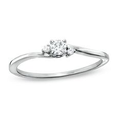 a white gold ring with three diamonds