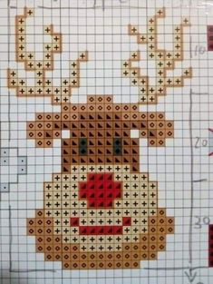 a cross stitch pattern of a reindeer with red nose and antlers on it's head