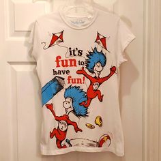 Nwot Mighty Fine Women's Large (Juniors) Dr. Seuss The Cat In The Hat Thing 1 & Thing 2 "It's Fun To Have Fun!" T-Shirt Blue Top With Funny Print, Fitted Playful T-shirt With Cartoon Print, Playful Fitted T-shirt With Character Print, Fitted Blue Tops With Funny Print, Fitted Blue Top With Funny Print, Playful Fitted Tops With Character Print, Fitted Playful Tops With Character Print, Casual Fitted Top For Fan Merchandise, Fun Crew Neck Top With Logo Print