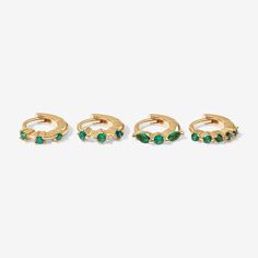 Make these colorful huggie earrings’ your new timeless treasures. Roland's delicate design, with feature emerald crystal detailing, will bring just the right amount of luxe to any ensemble. Perfect for stacking with more huggies, studs or ear cuffs. Created for you with a sterling silver base and utilizing an extra luxurious 14 karat gold plating, this earring set is everything you love about our demi-fine jewelry collection. Model is wearing Roland in her helix. Earrings Piercings, Emerald Earring, Piercings Ear, Emerald Crystal, Luxe Jewelry, Girl Jewelry, Demi Fine Jewelry, Emerald Earrings, Ear Cuffs