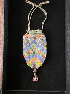 This is a small Victorian Early 1900's Floral Beaded Lady's Reticule Handbag. I really good condition for it's age. Looks like all beads are intact. Lining in good condition. Label inside says Germany. Bag (not including tassle and drawstring) is 5" X 3" Antique Handmade Multicolor Bags, Antique Multicolor Handmade Bags, Early 1900s, Clutch Handbag, Evening Bags, Purses And Handbags, Clutches, Germany, Angeles