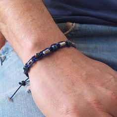 This bracelet is so comfortable and lightweight that you will definitely be going to wear it all day long even when showering or swimming I've designed it for men but it can easily be worn by women and teenagers too! ➽DESCRIPTION I've made this bracelet of 8 round blue-green azurite beads and 7 barrel raw sterling silver oxidized beads all attached to a blue minimal macrame design. A macramé finish allows the bracelet to be adjusted in length. At the end of the cord, there is an azurite bead and Blue Beaded Bracelets With Sliding Knot For Everyday, Adjustable Lapis Lazuli Beaded Bracelets For Everyday, Blue Friendship Bracelets For Gift, Minimal Macrame, Boyfriends Gift, Blue Macrame, Silver Beaded Bracelet, Sterling Silver Bead Bracelet, Men Bracelet