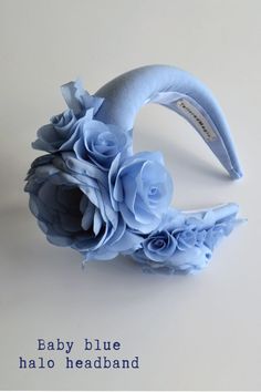 ◆ Dusty blue wedding guest headband hat. Floral headpiece for wedding inspired by Kate Middleton. Baby blue fascinator hat for women is hand made and hand stitched.◆ Padded halo headband has been covered in dusty blue fabric. Halo crown headpiece has been trimmed with flowers and leaves covering the right ear side. Modern and elegant flower crown for adult will instantly elevate any outfit.◆ The fascinator headband is unique work. One size Blue Headpieces For Spring Weddings, Summer Blue Headpiece With Handmade Flowers, Adjustable Blue Headband For Spring, Spring Blue Mini Hats With Handmade Flowers, Blue Headband For Summer, Blue Headband For Kentucky Derby, Blue Headpieces For Summer Garden Party, Blue Mini Hat Headband For Spring, Elegant Blue Fascinator With Handmade Flowers