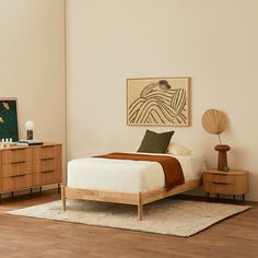 a bed room with a neatly made bed and two night stands