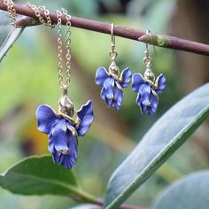 Our beautiful Iris flower necklace and earrings set is a beautiful way to add a splash of colour and elegance to your outfit. Both earrings and necklace are hand finished in blue enamel. This beautiful flower jewellery embodies nature with its intricate realistic design and attention to detail. Designed by us, in our London office. The Iris is a symbol of hope, wisdom, trust and valor. Irises make fabulous gifts for nature lovers, they are the birth flower for the month of February, the gift to Blue Sterling Silver Jewelry With Birth Flower, Blue Sterling Silver Birth Flower Jewelry, Elegant Enamel Jewelry As Gift For Her, Blue Flower-shaped Jewelry For Her, Blue Flower-shaped Jewelry With Flower Charm, Blue Flower Charm Jewelry As Gift For Her, Elegant Blue Jewelry With Birth Flower, Elegant Blue Flower Pendant Necklace, Elegant Blue Birth Flower Earrings