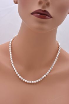 This beautiful Swarovski pearl necklace is perfect for your wedding day or bridesmaids. Made with dainty 6mm Swarovski pearls and a silver plated extension chain and lobster clasp. Each comes in a gift box, perfect for gift-giving. Pearl available in white or ivory (light pink, light grey and dark grey available upon special order). **SIZING - PLEASE READ: These are adjustable in a 2 inch range and are available in two sizes: 16-18 inches or 18-20 inches. Note that necklaces will fit differently Pearl Necklace Outfit, Bridesmaid Necklaces, Tiny Pearl Necklace, Real Pearl Jewellery, Ivory Pearl Necklace, Swarovski Pearl Necklace, Classic Pearl Necklace, Layered Pearl Necklace, Necklace Outfit