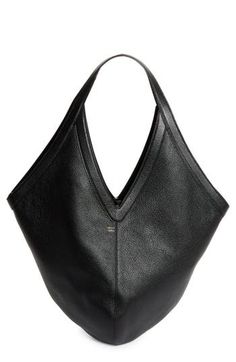 A sculptural shape subtly alludes to the 'M' in Mansur on a pebbled-leather shoulder bag detailed with a soft suede lining and slender tie closure. Tie closure Shoulder straps Suede lining Leather Made in Italy Designer Handbags Structured Leather Hobo Bag For Daily Use, Luxury Structured Hobo Bag For Formal Occasions, Chic Pebbled Leather Shoulder Bag With Leather Lining, Elegant Evening Hobo Bag With Leather Lining, Modern Formal Hobo Bag With Leather Handles, Modern Structured Leather Hobo Bag, Modern Hobo Bag With Leather Handles For Formal Occasions, Chic Black Calf Leather Hobo Bag, Chic Formal Hobo Bag With Leather Handles