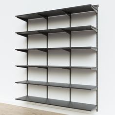 an empty shelving unit on a white wall