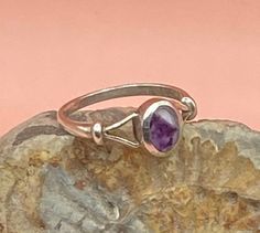 Sterling Silver vintage ring with an oval, bezel set bandedAmethyst cabochon in shades of purple. This pretty, boho style solid silver ring has split shoulders and is stamped SIL for silver.  Good vintage condition  UK size N, US size 7  The stone measures 7 x 5 mm Weight 2g Please study the photographs where I try to show as much detail as possible. Any damage or obvious imperfections will be clearly stated. I offer FREE SHIPPING on all of my listings so the price you see is the price you pay! Classic Oval Cabochon Amethyst Jewelry, Classic Amethyst Oval Cabochon Ring, Purple Oval Cabochon Hallmarked Ring, Vintage Oval Amethyst Birthstone Ring, Classic Silver Amethyst Ring Oval Cabochon, Classic Silver Amethyst Oval Cabochon Ring, Classic Silver Oval Cabochon Amethyst Ring, Classic Silver Amethyst Ring With Oval Cabochon, Classic Amethyst Cabochon Ring