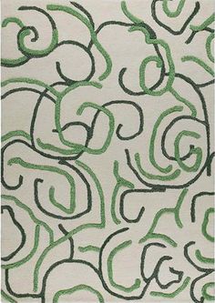 a green and white rug with swirls on it