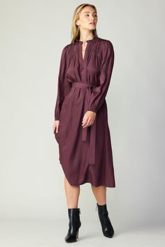 This long-sleeve dress boasts a ruffle-trimmed split neckline and a smocked yoke before falling to a shin-skimming skirt. A self-tie belt cinches the waist, defining your shape and adding a touch of refinement. The perfect blend of understated sophistication and feminine ease. •Split neckline •Ruffle trim •Smocked yoke •Long sleeves with elasticized cuffs •Optional self-tie belt Item number 2390026 100% Polyester Midi Dress With Smocked Cuffs For Work, Midi Dress With Smocked Cuffs For Office, Chic Long Sleeve Dress With Pintucks, Fall Midi Dress With Bishop Sleeves For Daywear, Chic Long Sleeve Midi Dress With Smocked Cuffs, Fall Long Sleeve Pintuck Dress, Elegant Knee-length Smocked Dress For Fall, Smocked Midi Dress For Fall, Elegant Fall Midi Dress With Smocked Cuffs