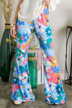 This Item is Final Sale Unleash your wild side with our Everlane Multi Print Flare Pants! These bell bottom pants are not your average pair, with a mix of floral prints that are sure to turn heads. The elastic waist ensures a comfortable fit while the flare design adds a touch of retro style. 95% Polyester & 5% Spandex Spring Hippie Wide Leg Flares, Hippie Wide Leg Spring Flares, Hippie Wide Leg Flares For Spring, Multicolor Floral Print Hippie Bottoms, Hippie Multicolor Floral Print Bottoms, Casual Flared Bottoms With Floral Print, Trendy Wide-leg Floral Print Pants, Trendy Floral Print Wide-leg Pants, Groovy Flare Bottoms For Summer