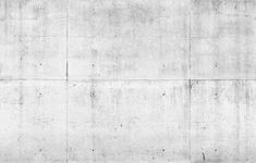 a black and white photo of a person on a skateboard in front of a concrete wall