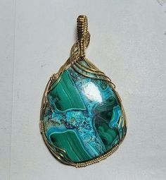 Bold Slide pendant featuring a beautiful 40x50mm gemstones with vibrant green Malachite and Caribbean blue Chrysocolla. It is hand crafted in 14K Yellow gold filled wire.  It has a 9x10mm bail opening to fit nearly any thickness of chain or up to a 10mm omega.  It measures approximately 2 3/4 inches long.  Looking for a certain color? Just ask!!  Matching earring charms are sold separately in my store.  All measurements are as close as possible within the limitations and restrictions imposed by the mounting.  Guaranteed to be BRAND NEW. The photos don't do it justice! Caribbean Blue, Green Malachite, Earring Charms, Vibrant Green, Charm Earrings, Matching Earrings, Gold Filled, Jewelry Necklace Pendant, Hand Crafted