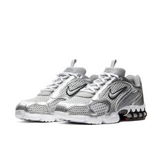 The Nike Air Zoom Spiridon Cage 2 Metallic Silver combines retro flair with futuristic design. Crafted for men, this sneaker features a mesh and synthetic leather upper coated in a sleek metallic silver finish. The raised Swoosh branding on the quarter panel adds a bold touch. Underfoot, a white foam midsole houses a caged Zoom Air unit in the heel for cushioning. The rubber outsole introduces hits of red for a pop of color. Whether you’re hitting the streets or making a style statement, these k Nike Air Zoom Spiridon, Early 2000s Style, Trendy Shoes Sneakers, Pretty Shoes Sneakers, Baskets Nike, Sneaker Release, Cute Sneakers, Nike Dunk High, Futuristic Fashion