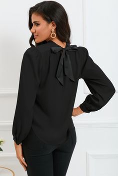 Unleash your inner wanderlust with our TRAVELING GYPSY blouse! The eye-catching color blocking adds a stylish pop, while the bow knot back detail adds a feminine touch. The mock neck provides a sophisticated and elegant look, making it the perfect choice for any occasion. Versatile, chic, and playful - this blouse is a must-have for any fashion-forward traveler! OUR SIZE CHART HACK! WE USE THESE ICONS AS A GUDIE TO INFORM OUR CUSTOMERS HOW THE MEASURMENTS COMPARE TO A STANDARD U.S. SIZE CHART SO YOU CAN MAKE THE BEST DECSION WHEN ORDERING. 🔷Runs True ⏹️Runs Small 🌗In between 🟡Runs Large 🌀Junior Size 🅾️One Size Size Chart (INCH) 🔷 Sizes Bust Shoulder Sleeve Length Hem S 42.5 14.0 24.2 23.6 47.2 M 44.9 14.6 24.6 24.4 49.6 L 47.2 15.2 25.0 25.2 52.0 XL 50.4 16.0 25.4 26.0 55.1 2XL 53.5 Elegant Black Top With Tie Back, Black Bow Blouse For Fall, Fall Tops With Bow Detail, Solid Color Tops With Bow For Fall, Chic Black Tie Neck Blouse, Chic Tie Back Top For Work, Chic Tie-back Tops For Work, Chic Black Tie Neck Top, Black Tie Neck Blouse With Bow