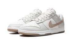 The Nike Dunk Low SE “Phantom/Khaki” is a colorway of the retro basketball shoe with a clean and easy-wearing design.  The upper is complete with a white leather base and Phantom-colored leather overlays.  A hairy suede Khaki Swoosh can be found on the sides, while “Nike” branding is embroidered on the heel.  A “Nike” and Swoosh logo also appear on the tongue tag.  Underfoot, a white rubber midsole and Khaki rubber outsole completes the look.  Release date: April 2, 2024 Jordan Golf, Nike X Travis Scott, Nike Branding, Retro Basketball Shoes, Retro Basketball, Jordans Women, Dunks Nike, Kids Converse, Nike Brand