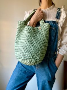 Whether you're exploring city streets, strolling through the farmer's market, or going to the beach, this versatile crochet tote bag is your go-to companion. Its soft, slouchy silhouette and comfortable shoulder straps ensure all-day comfort, while its mint green hue adds a playful pop of color to any your favorite summer outfits, from breezy dresses to casual T-shirt and jeans. With its timeless appeal and artisanal charm, handmade crochet hobo bag is sure to become a beloved addition to your c Eco-friendly Hobo Bag For Daily Use In Spring, Spring Bucket Bag With Handles, Spring Everyday Bucket Bag With Handles, Crochet Shoulder Bag For Daily Use In Spring, Trendy Handmade Hobo Bag For Everyday, Spring Crochet Shoulder Bag For Daily Use, Casual Everyday Handwoven Bucket Bag, Casual Handwoven Everyday Bucket Bag, Green Bucket Bag For Everyday Spring Use