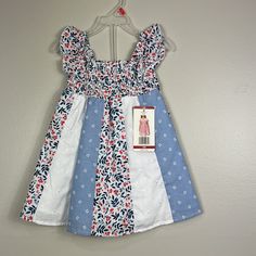 New With Tags Penelope Mack Red White Blue Floral Dress. Comprised Of Different Fabrics. Sleeveless. Smocked At Chest And Lined. Size 18 Months Patriotic And Perfect For The Fourth Of July! 100% Cotton Lining 80% Cotton 20% Poly Smoke Free Home Thank You So Much For Visiting My Closet! Bundle And Save! I Love Offers! Please Keep In Mind That Poshmark Takes A Flat Fee Of $2.95 On All Orders Under $15. For Orders Over $15, Poshmark Takes A 20% Commission. Shop With Confidence. I Have A 5 Seller Ra Multicolor Cotton Holiday Dress, Holiday Multicolor Cotton Dress, Multicolor Cotton Dress For Holiday, Playful Sleeveless Holiday Dress, Blue Summer Dress For Playtime, Casual White Sundress For Dress-up Occasions, Casual White Sundress For Dress-up, Blue Sundress For Summer Playtime, White Sundress For Playtime