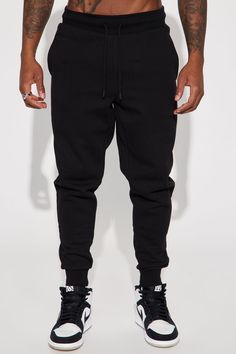 Model Height: 6'1 - Waist: 32 - Wearing Large Big & Tall: Height 6'3 - Waist: 42 - Wearing XXXL Available In Black, Grey, White, Navy, And Red Elastic Waist With Drawstring Side Hand Pockets Back Patch Pocket Ribbed Cuff At Bottom Of Leg 80% Cotton 20% Polyester Imported | Mens Tyson Jogger Pant in Black size Large by Fashion Nova Black Tapered Leg Sweatpants For Streetwear, Casual Black Fitted Joggers, Casual Fitted Black Joggers, Urban Black Tapered Leg Joggers, Fitted Black Casual Sweatpants, Fitted Black Sweatpants With Pockets, Black Cotton Joggers For Winter, Black Cotton Winter Joggers, Black Tapered Leg Sweatpants For Winter