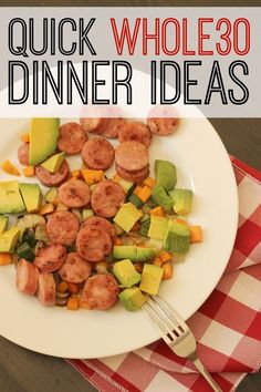 a white plate topped with meat and veggies next to a red checkered table cloth